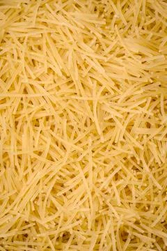 Fine vermicelli paste is yellow in color when raw Stock Photos