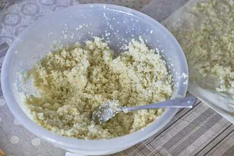 Finely chopped cabbage for stuffing in a dish on the table Stock Photos