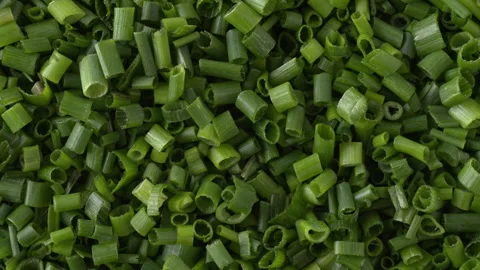 Finely chopped chives full frame background texture rotating close up view. Stock-Footage 342277110