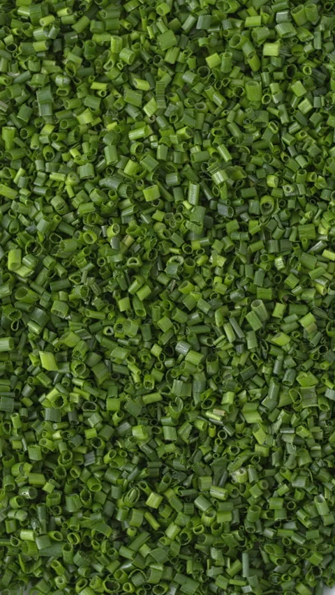 Finely chopped chives full frame background texture wide view, vertical video. Stock Footage 342277197