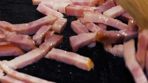 Finely chopped ham is fried in hot oil in a pan. Stock Footage 126488477