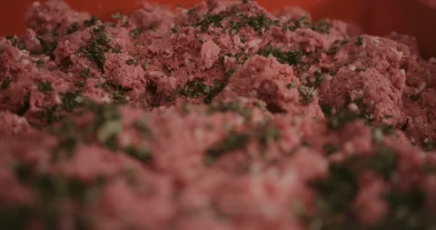 Finely chopped herbs in ground beef Stock-Footage 105297056