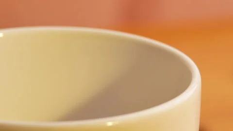 Finely ground roasted coffee fall into a white cup, ready for brewing. Stock Footage 157085495