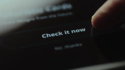 Finger about to tap the Check it now button Stock Footage 327451407