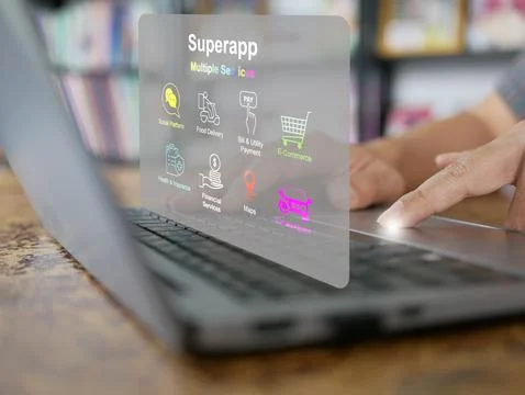 Finger activates a virtual screen of a super app on a computer notebook or .. Foto stock