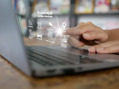 Finger activates a virtual screen of superapp on computer notebook or lapto.. Foto stock
