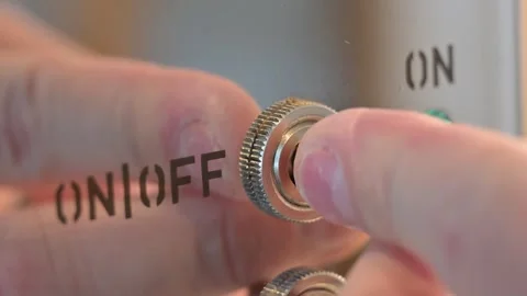 Finger Activating Toggle Switch on Metal Machine – Industrial Control Stock Footage 345204087