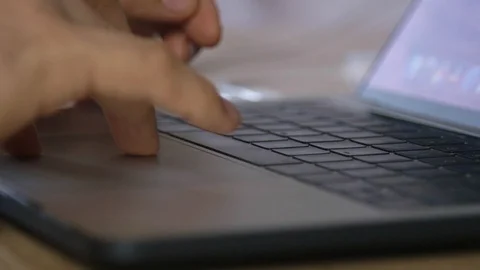 Finger actively using touchpad on notebook Stock-Footage 122626656