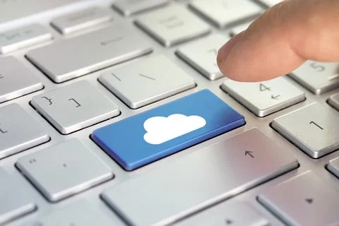 Finger and button with cloud. Cloud computing concept on computer keyboard 스톡 사진