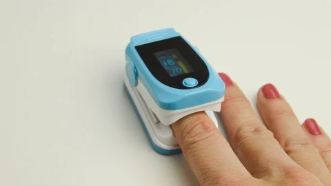Finger and oximeter Stock Footage 119772007