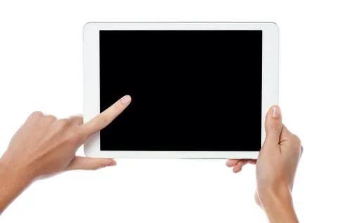 Finger being pointed on tablet screen Stock Photos