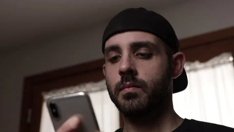 Finger of bored man scrolls page app on mobile phone. Stock Footage 168083096