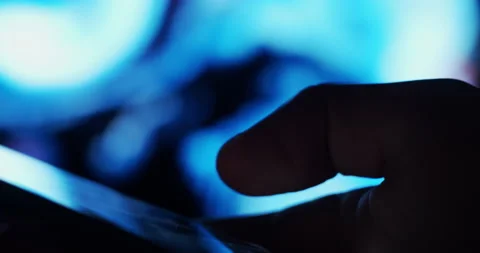 Finger browsing smartphone at night with lights in the background Stock Footage 200925815
