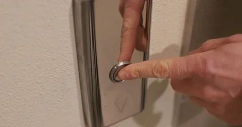 A finger on the button to call the elevator Stock Footage 176832948