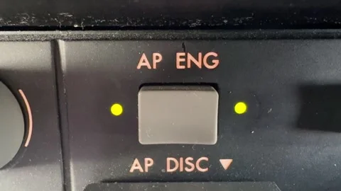 Finger of a Caucasian Pilot Engaging the Autopilot in a Modern Jet Cockpit Stock Footage 328072559