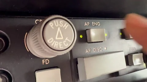 Finger of a Caucasian Pilot Engaging the Autopilot Pushing AP Button. Extreme Stock Footage 328142706