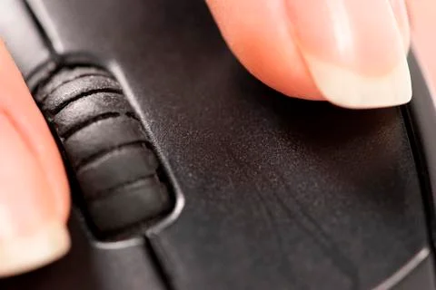 Finger click on the computer mouse. Macro Stock Photos