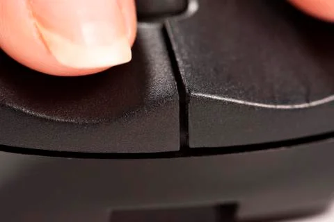 Finger click on the computer mouse. Macro Stock Photos