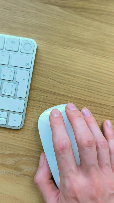 Finger clicking a mouse while scrolling forward and back. Vertical view of .. Stock Footage 340283673