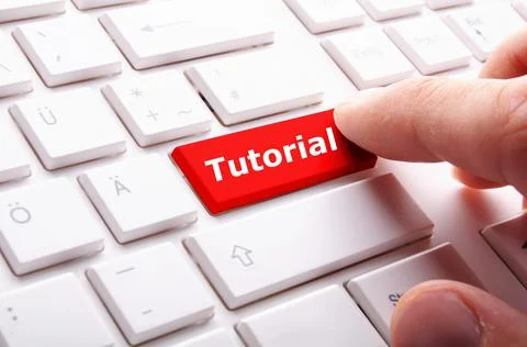 Finger clicking"Tutorial" button on computer keyboard -internet or online softwa Stock Photos
