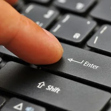 Finger on computer keyboard Stock Photos