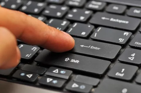 Finger on computer keyboard Stock Photos
