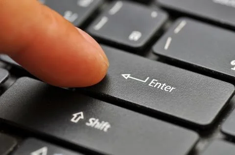 Finger on computer keyboard Stock Photos