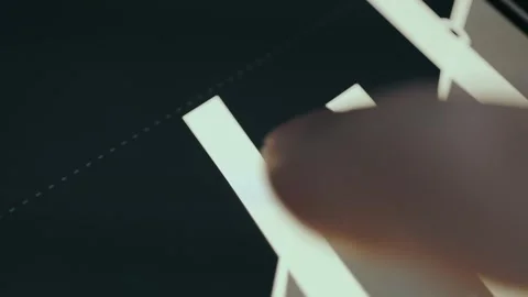 Finger controlling a financial data graph on screen Stock Footage 333401415