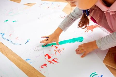 Finger drawing as a developmental exercise for children Stock Photos