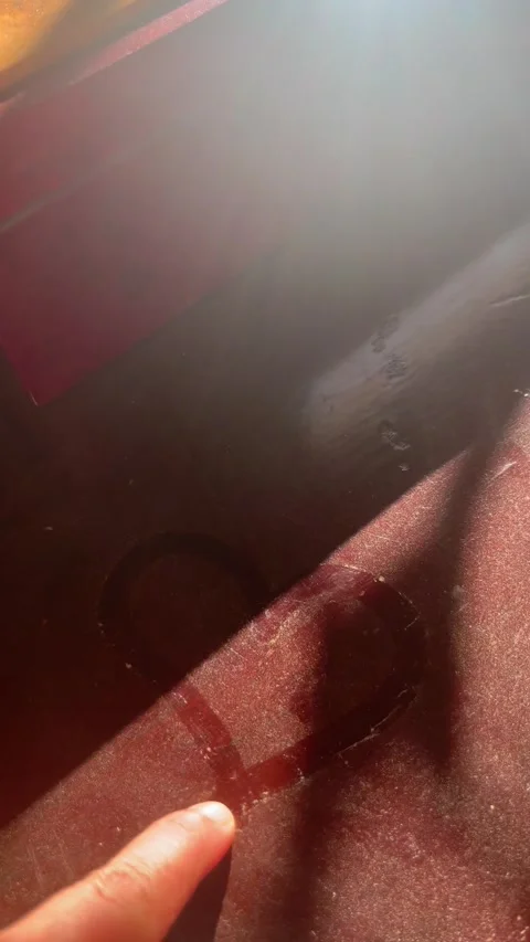 Finger Drawing a Heart Shape on Dusty Wooden Surface in Sunlight Stock Footage 345305617