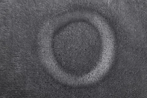 Finger drawn circle frame on soft fleece material structure, abstract textu.. Stock Photos