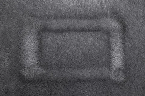 Finger drawn rectangle shaped  frame on soft fleece material structure, abs.. Stock Photos