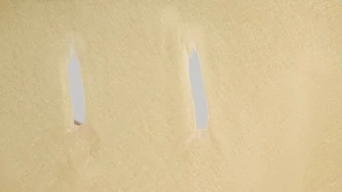 Finger draws a smiley face on a golden background Stock Footage 278048012