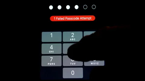 Finger entering a correct six digit passcode on a device after 1 failed attempt. Video stock 242613042