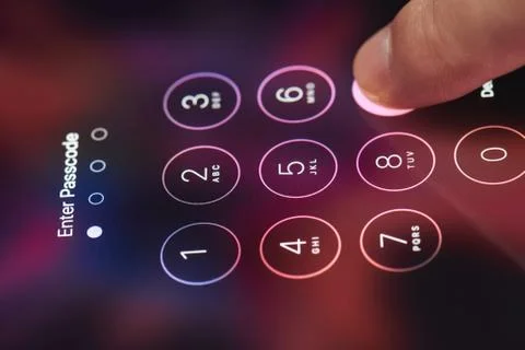 Finger entering passcode on smartphone Foto stock