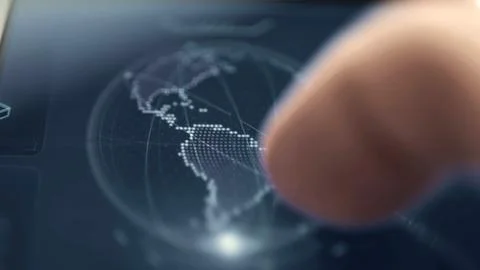Finger explores interactive digital world map Stock Photos