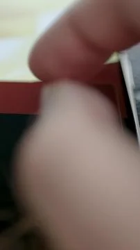 Finger Exploring AI Cost Analytics on Vertical Screen Stock Photos