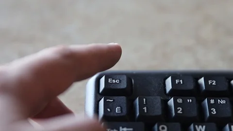 Finger fearfully Pressing Esc Button On Computer Keyboard Stock Footage 124499434