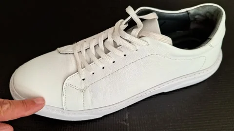 Finger Highlighting Scuff Marks on White Leather Sneaker Stock Footage 341312813