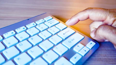 Finger hitting enter key many times on a keyboard with anger. Stock Footage 145451927