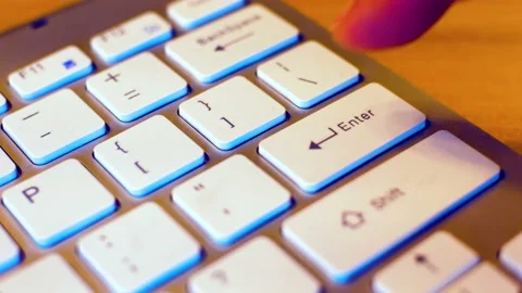 Finger hitting enter key one times on a keyboard. Stock Footage 134685710