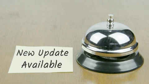 Finger Index Ringing Bell with New Upadate Text or Word on Yellow Note Paper Stock Footage 300870974