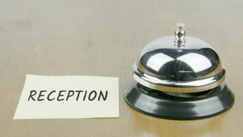 Finger Index Ringing Bell with Reception Text or Word on Yellow Note Paper Stock Footage 300877921