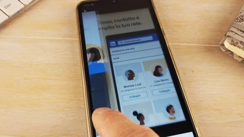 Finger installing LINKEDIN app on the phone Stock Footage 144119062