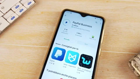 Finger installing the PAYPAL app on the phone Stock Footage 144136018
