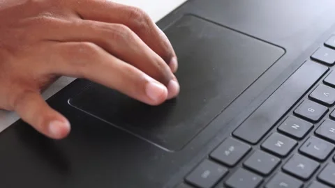 Finger interacting with laptop trackpad highlighting modern technology Stock Footage 328646148