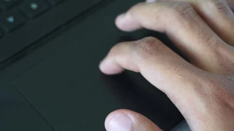 Finger interacting with laptop trackpad highlighting modern technology Stock Footage 328646186