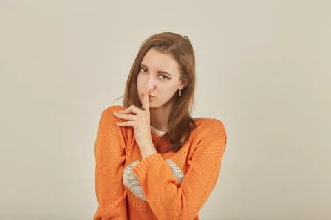 Finger on lips Photos