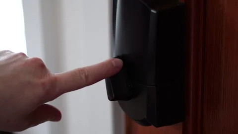 Finger locking a smart lock in slow motion Stock Footage 307155552