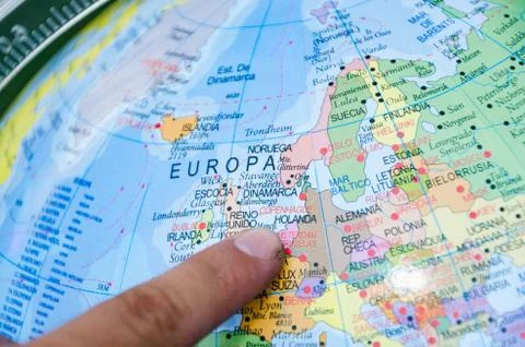 Finger of a man pointing to the next destination on a map. Stock Photos
